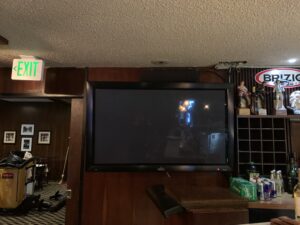 A TV monitor mounted on the wall